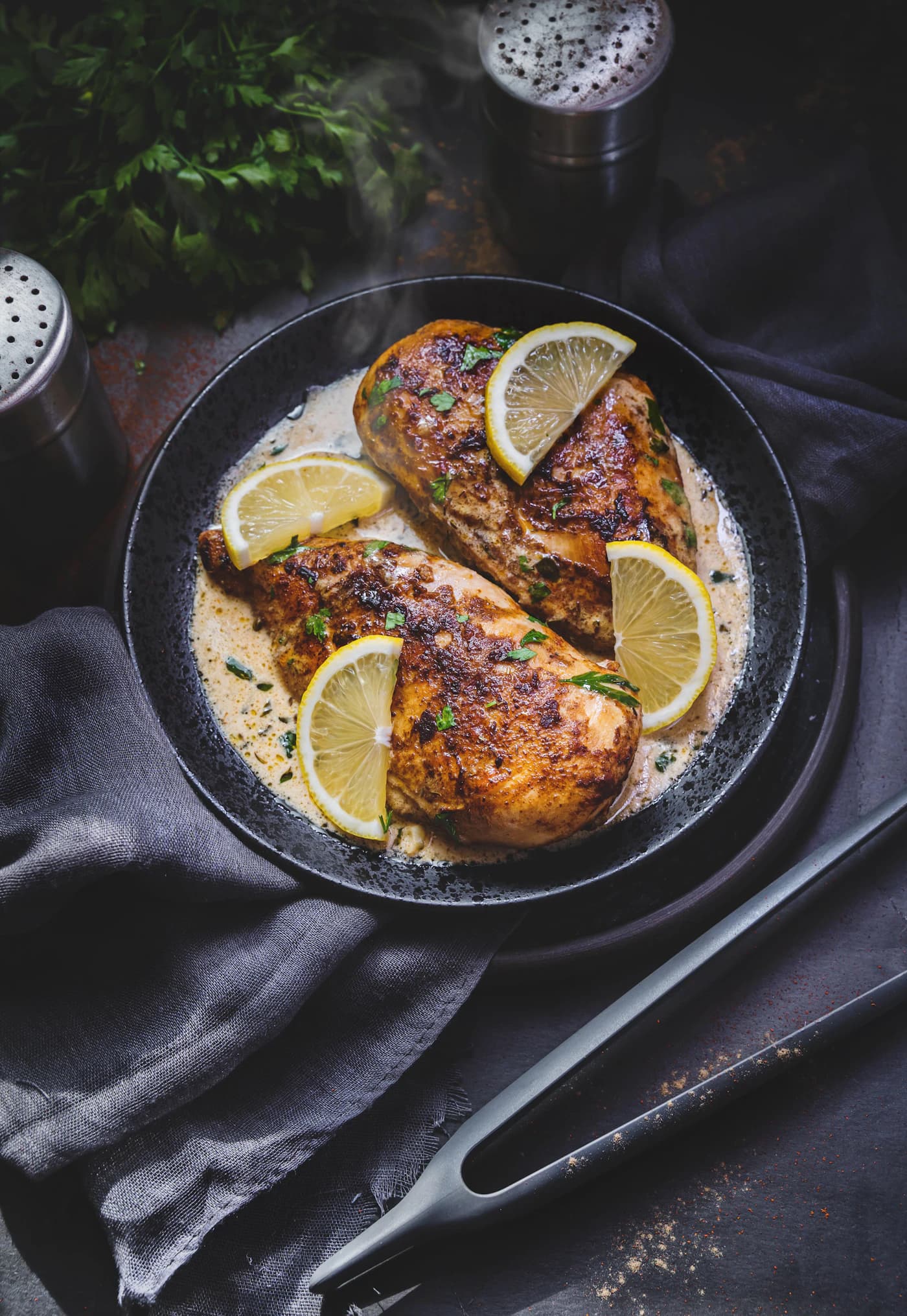 Representative creamy chicken photography with an optional lemon garnish